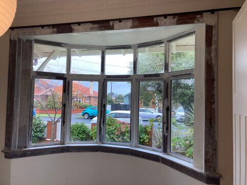 Curved window before painting - Interior view