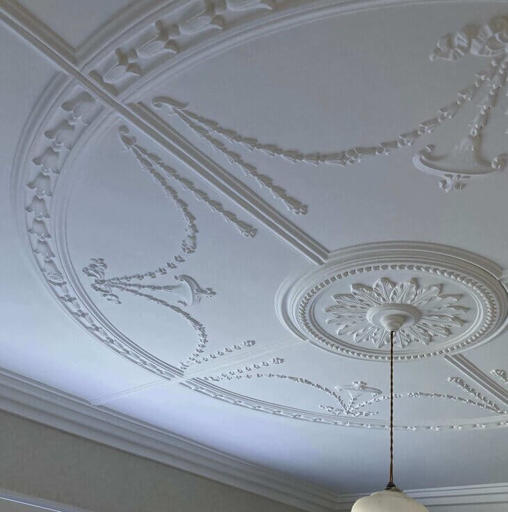 Ceiling painting project showcasing a transformed room with fresh paint