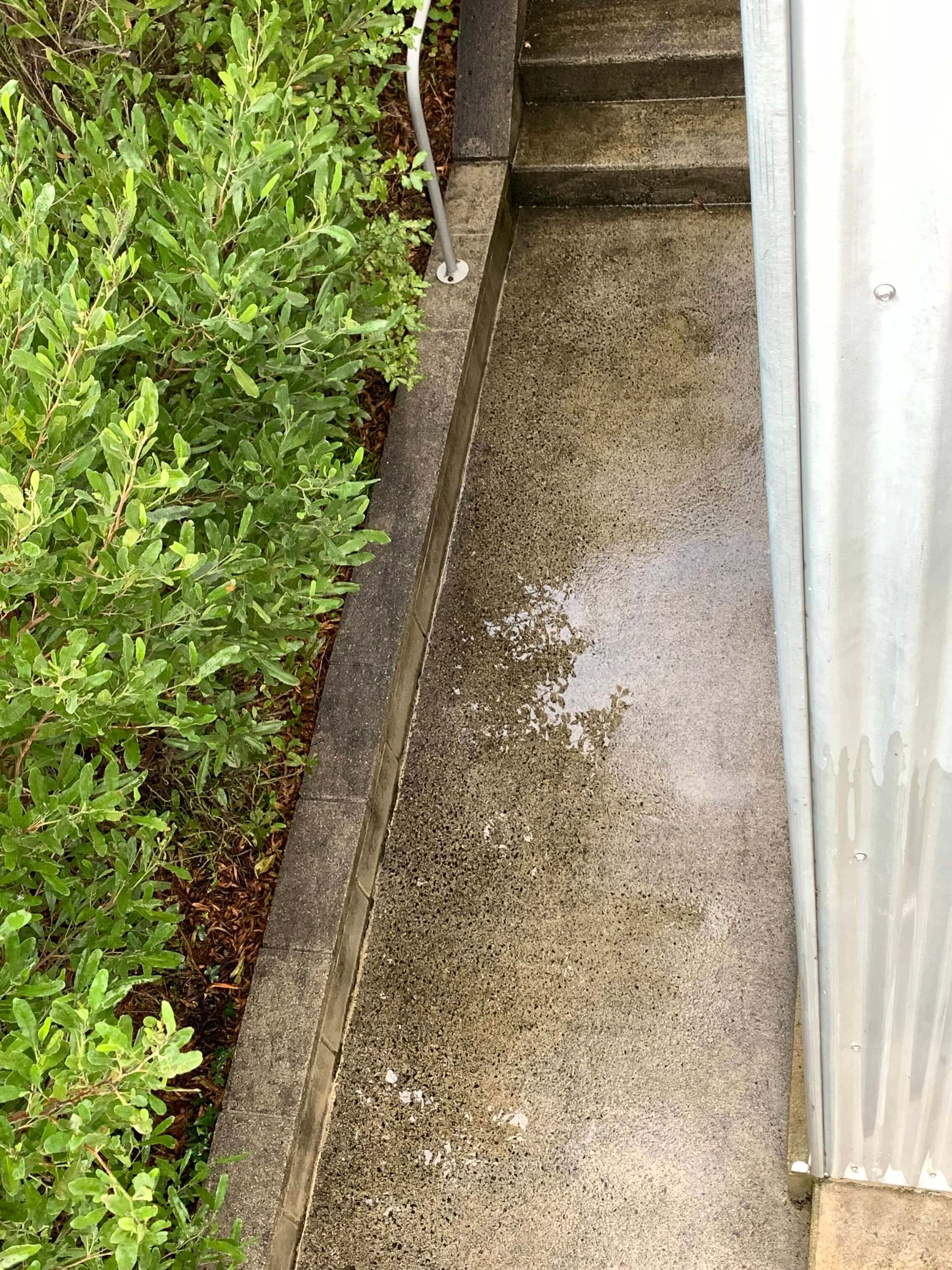 Clean and refreshed staircase after water blasting.