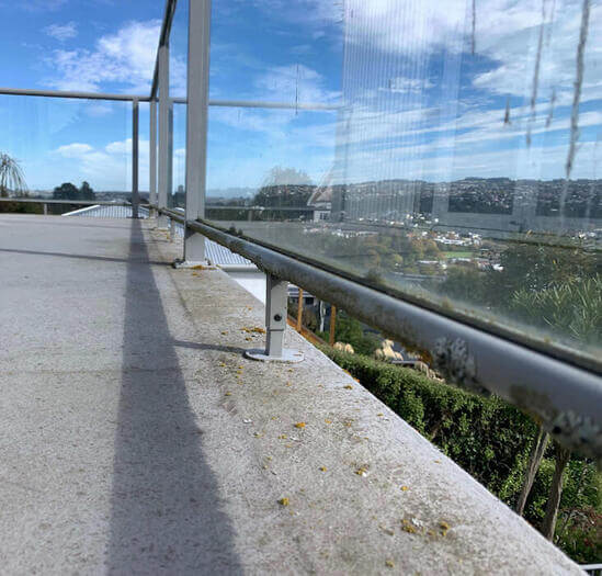 Balcony covered in grime prior to water blasting