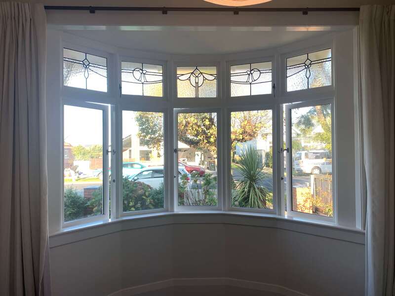 Interior painting on a curved window, enhancing its elegance and style